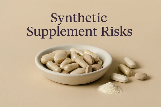 Editorial macro image of synthetic supplement tablets and capsules in a ceramic dish on a neutral beige background, representing synthetic supplement risks.